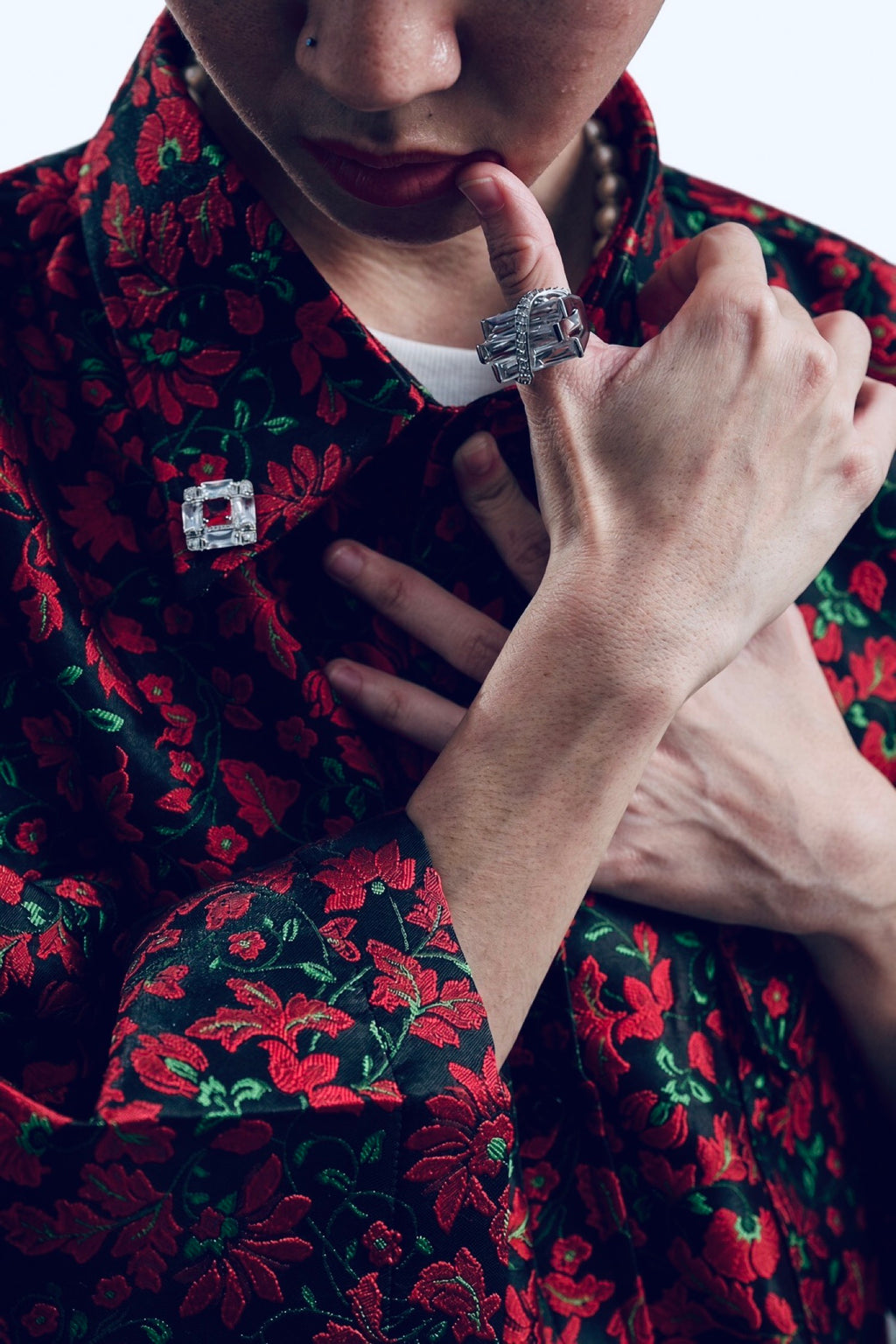 The Shirt cloth. Black, red flower, green stem.